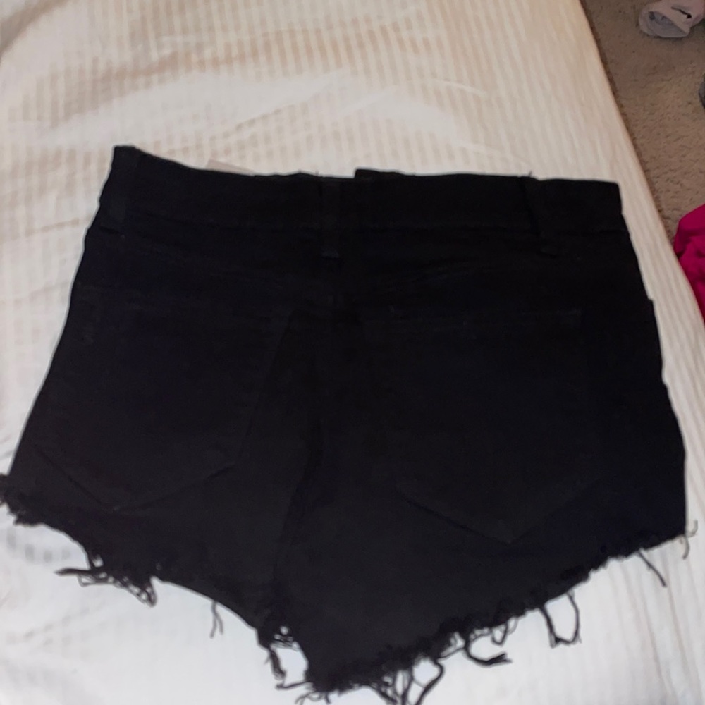 Stretchy black ripped jean shorts
